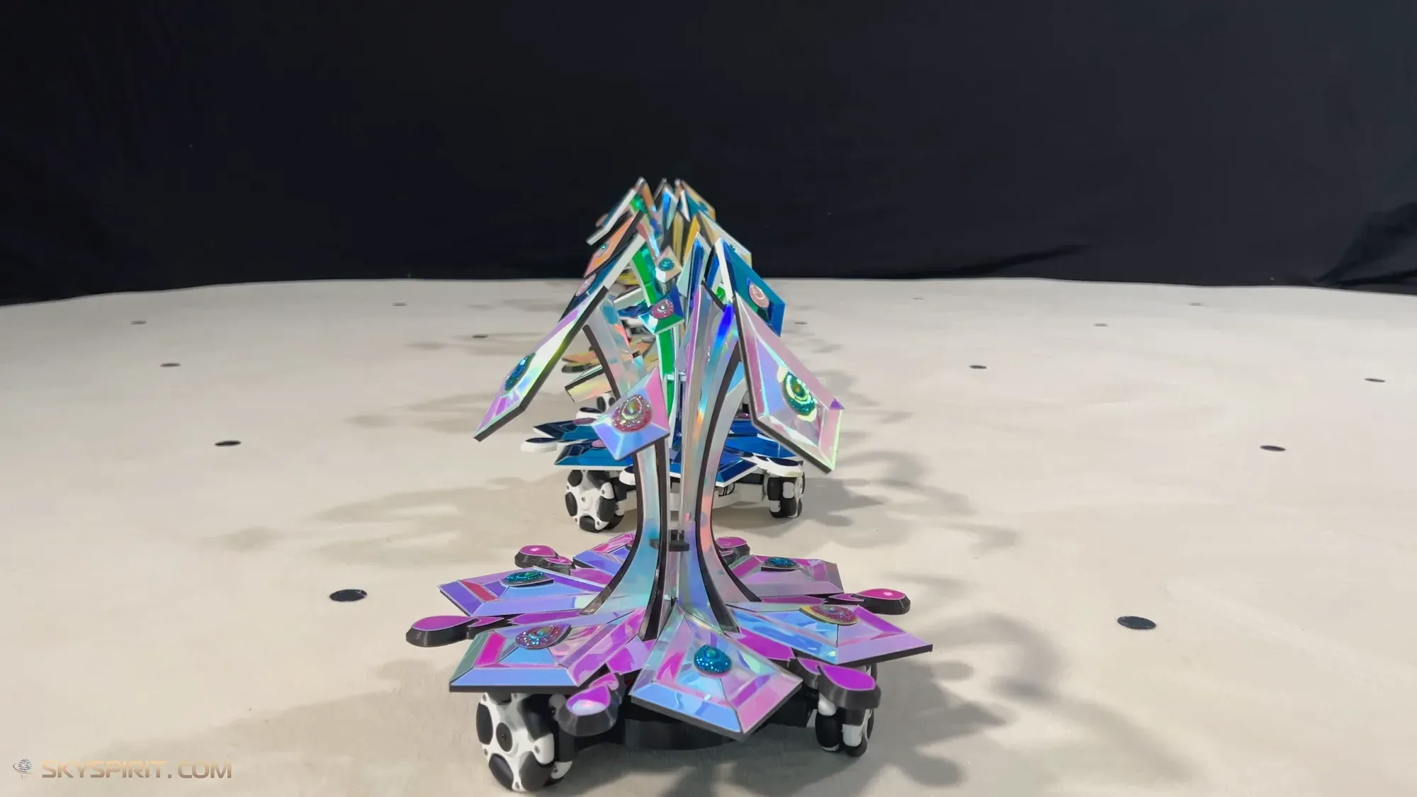 Star-flower robots lined up one behind the other